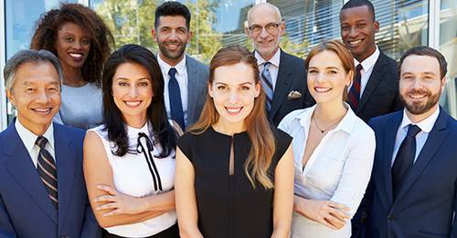 Diverse group of smiling business people in an outdoor setting